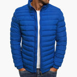 Blue puffer down jacket with full zip front and stand collar.