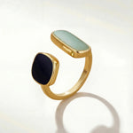 Gold-tone adjustable ring with oval mint and round dark cabochon stones