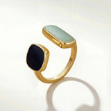 Gold-tone adjustable ring with oval mint and round dark cabochon stones