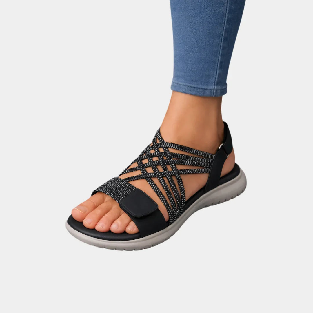 Black knit orthopedic sandals with open toe, crisscross straps, cushioned sole