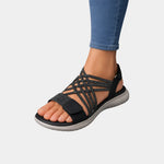 Black knit orthopedic sandals with open toe, crisscross straps, cushioned sole