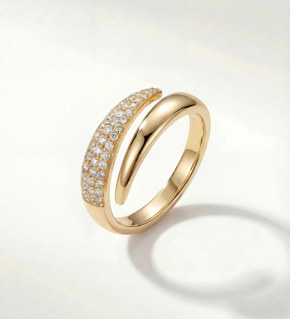 Gold adjustable band ring with sparkling pave stones, rounded profile