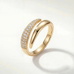 Gold adjustable band ring with sparkling pave stones, rounded profile