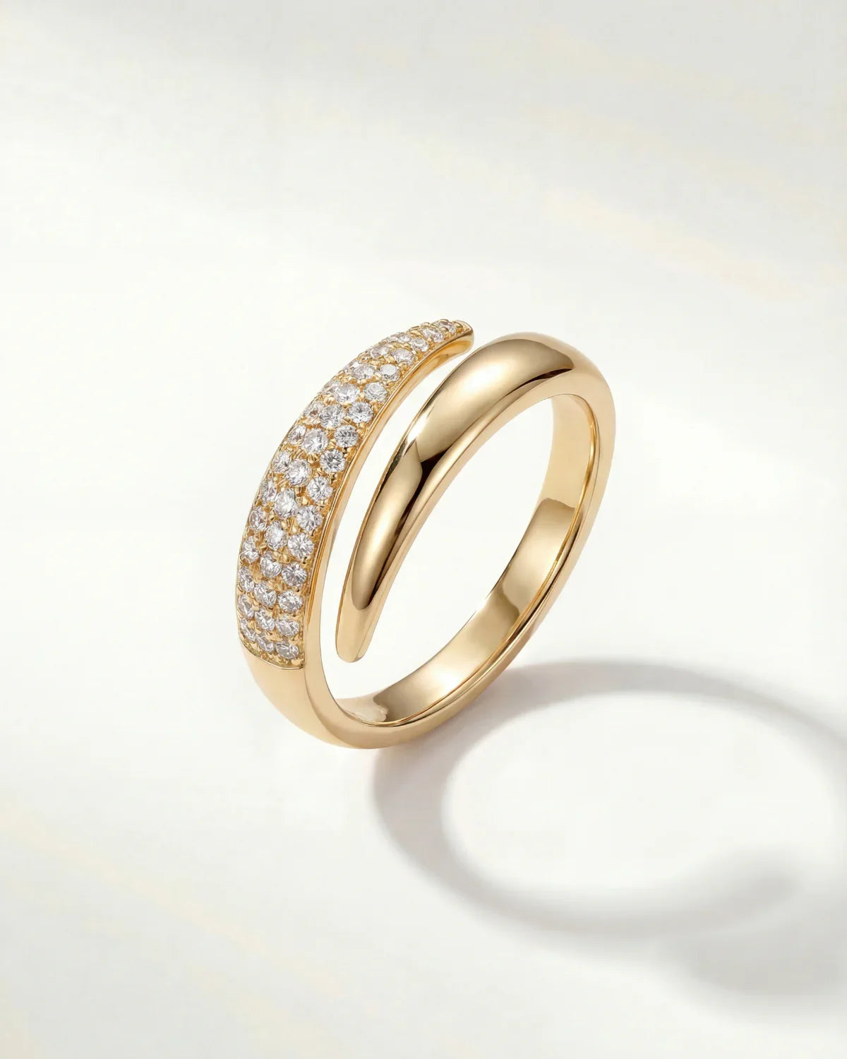 Gold adjustable band ring with sparkling pave stones, rounded profile