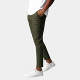 Olive green chino pants with front pockets and tapered ankle hem.