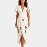 White wrap dress with short sleeves, floral print, belted waist and midi length