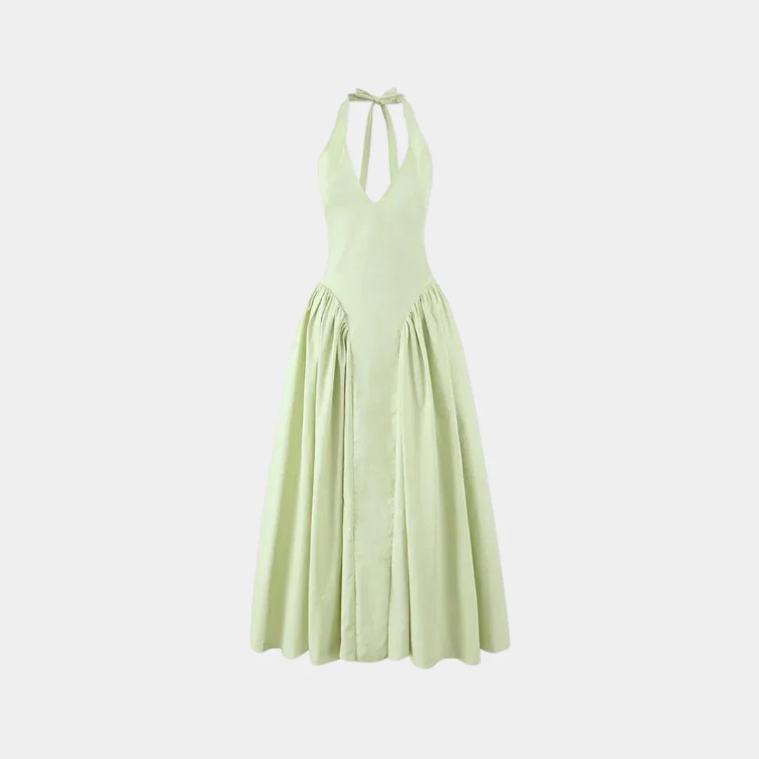 Light green halter maxi dress with tie straps, gathered waist, and full skirt