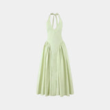 Light green halter maxi dress with tie straps, gathered waist, and full skirt
