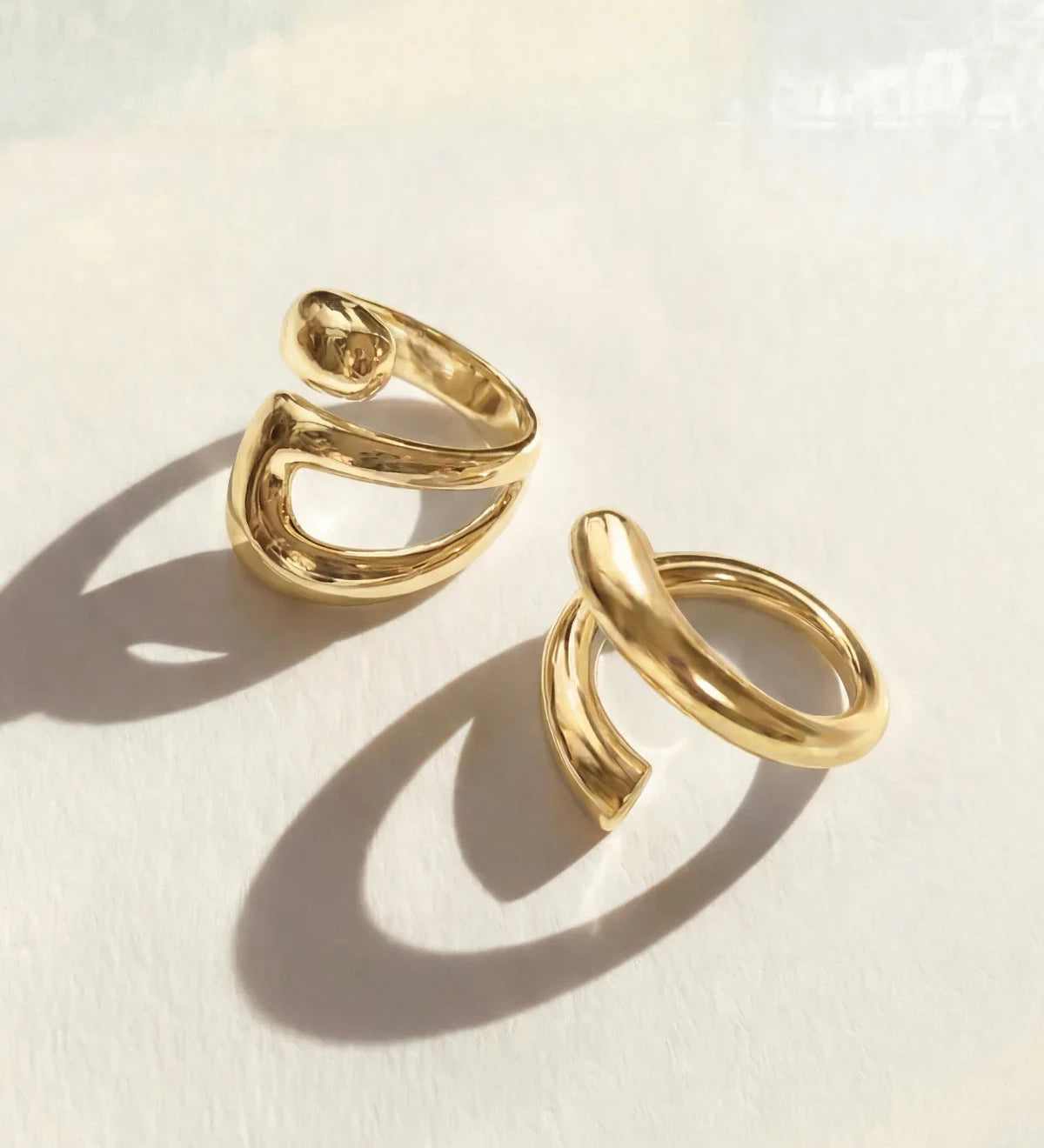Gold ring set with two stacked open oval bands, adjustable fit
