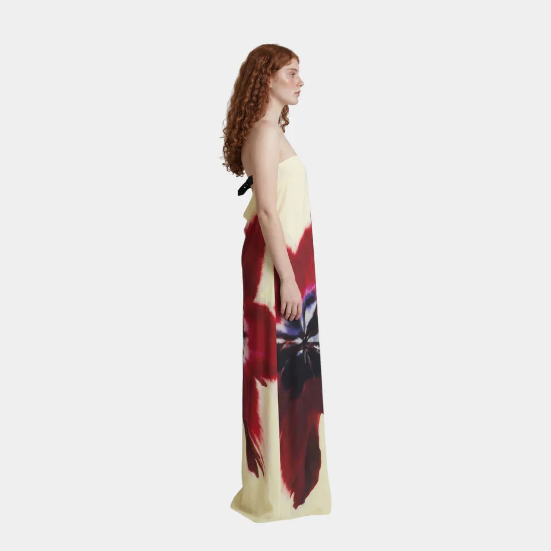 Side-view strapless maxi dress with red, cream, and black abstract print