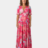 Pink long floral dress with V-neck, short puff sleeves, tiered maxi skirt
