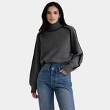 Dark gray knit turtleneck sweater with long sleeves and ribbed cuffs