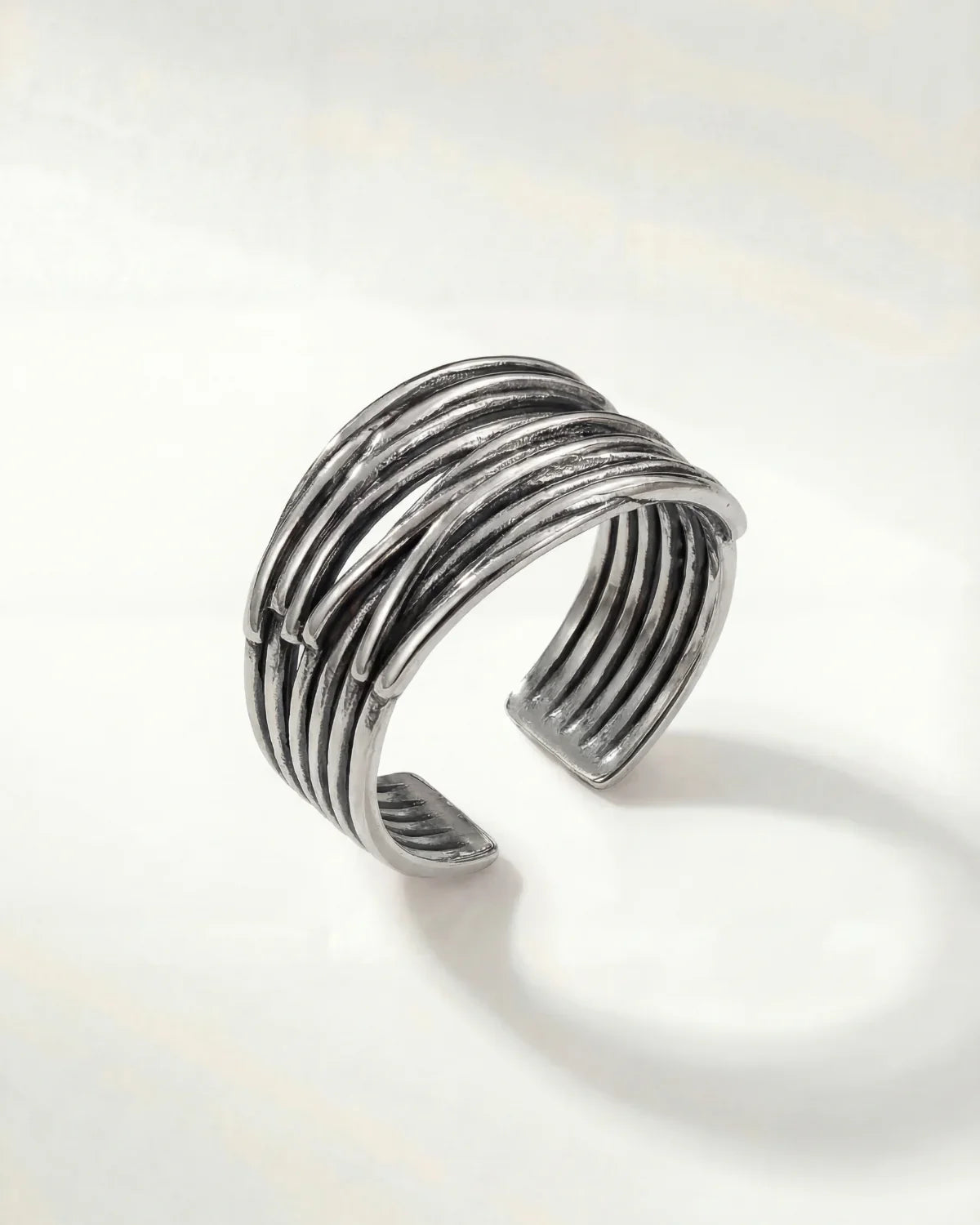 Silver modern ridged stack ring with open adjustable band