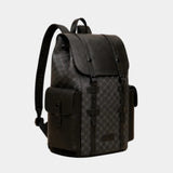 Dark leather backpack with curved flap, adjustable shoulder strap, and front buckle details