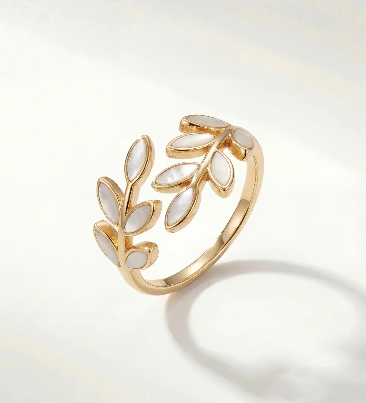 Gold leaf motif adjustable ring with openwork design