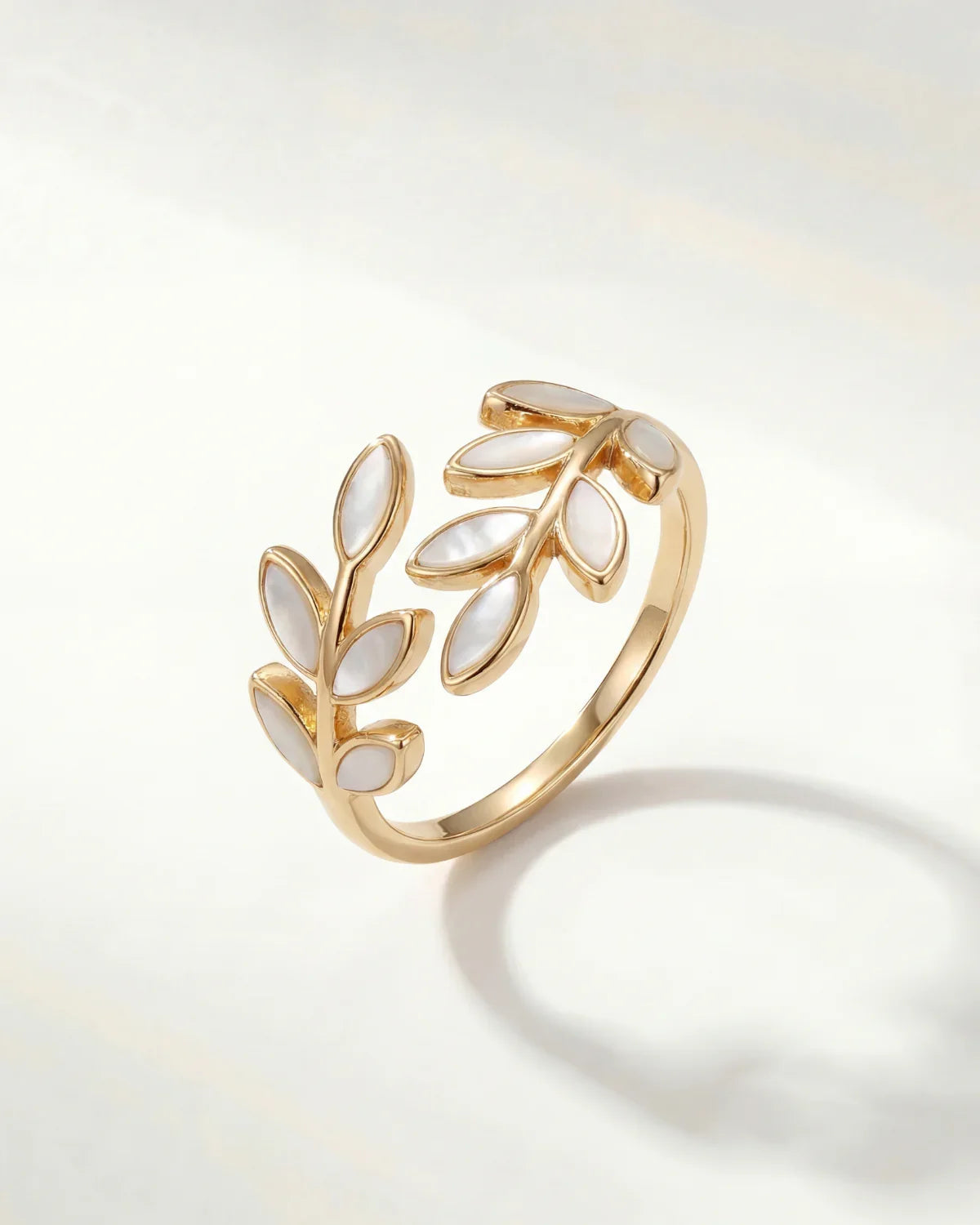 Gold leaf motif adjustable ring with openwork design