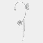 Silver magical ear cuff with butterfly and flower charms, dangling chain tassel