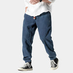 Navy blue corduroy pants with button fly and tapered legs