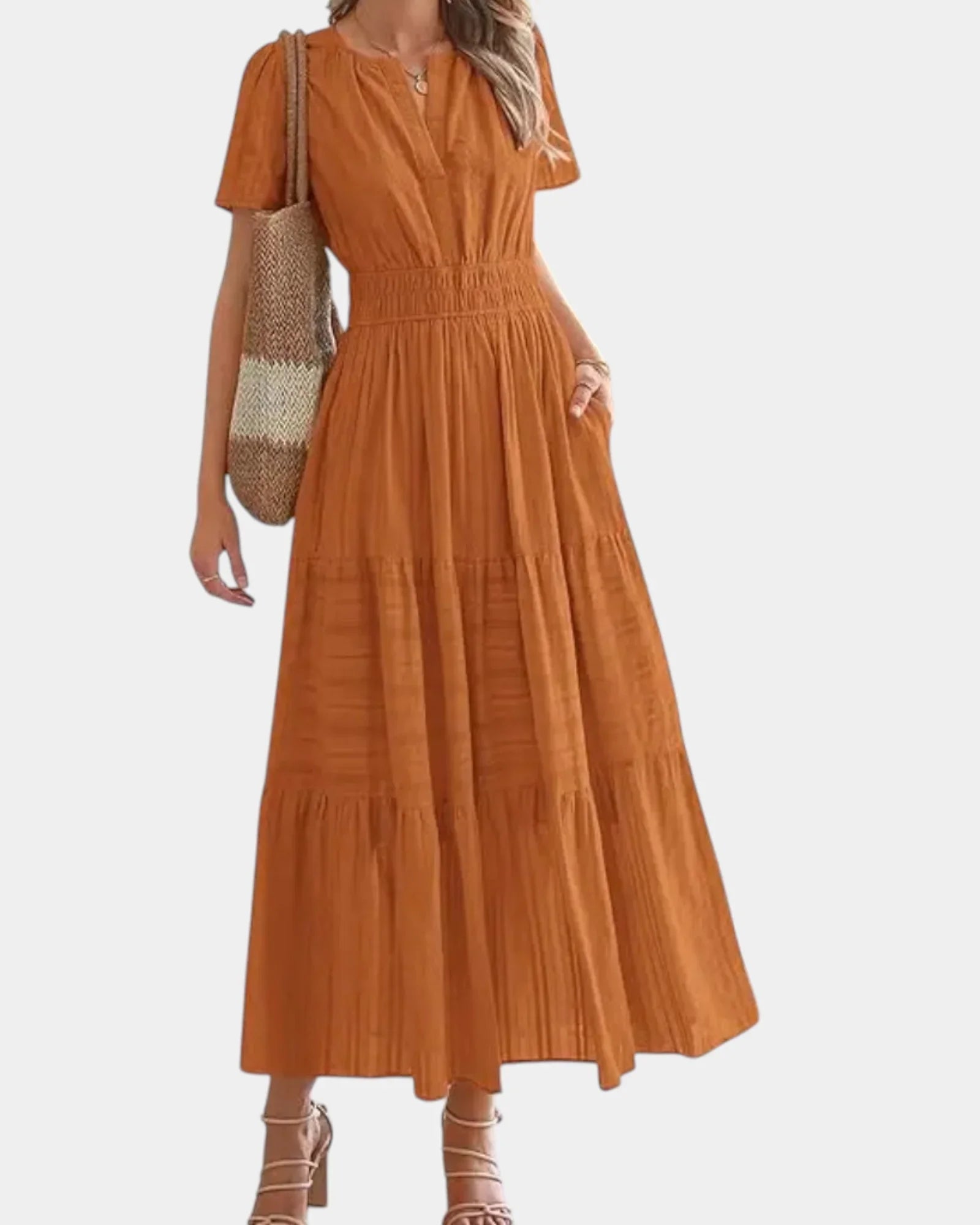 Rust orange tiered maxi dress with V-neck, short sleeves, and gathered waist seams