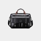 Black leather briefcase with top handle, shoulder strap, and front flap buckle pockets
