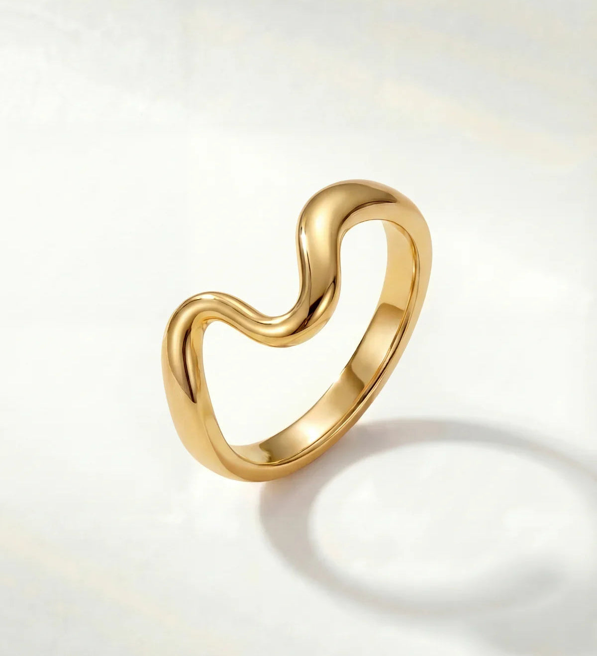 Gold wavy ring with a smooth polished band