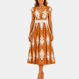 Apricot baroque-inspired midi dress with white ornate motif print, V-neck, cap sleeves