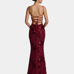 Burgundy floor-length gown with spaghetti straps, lace-up back, and floral embellishment