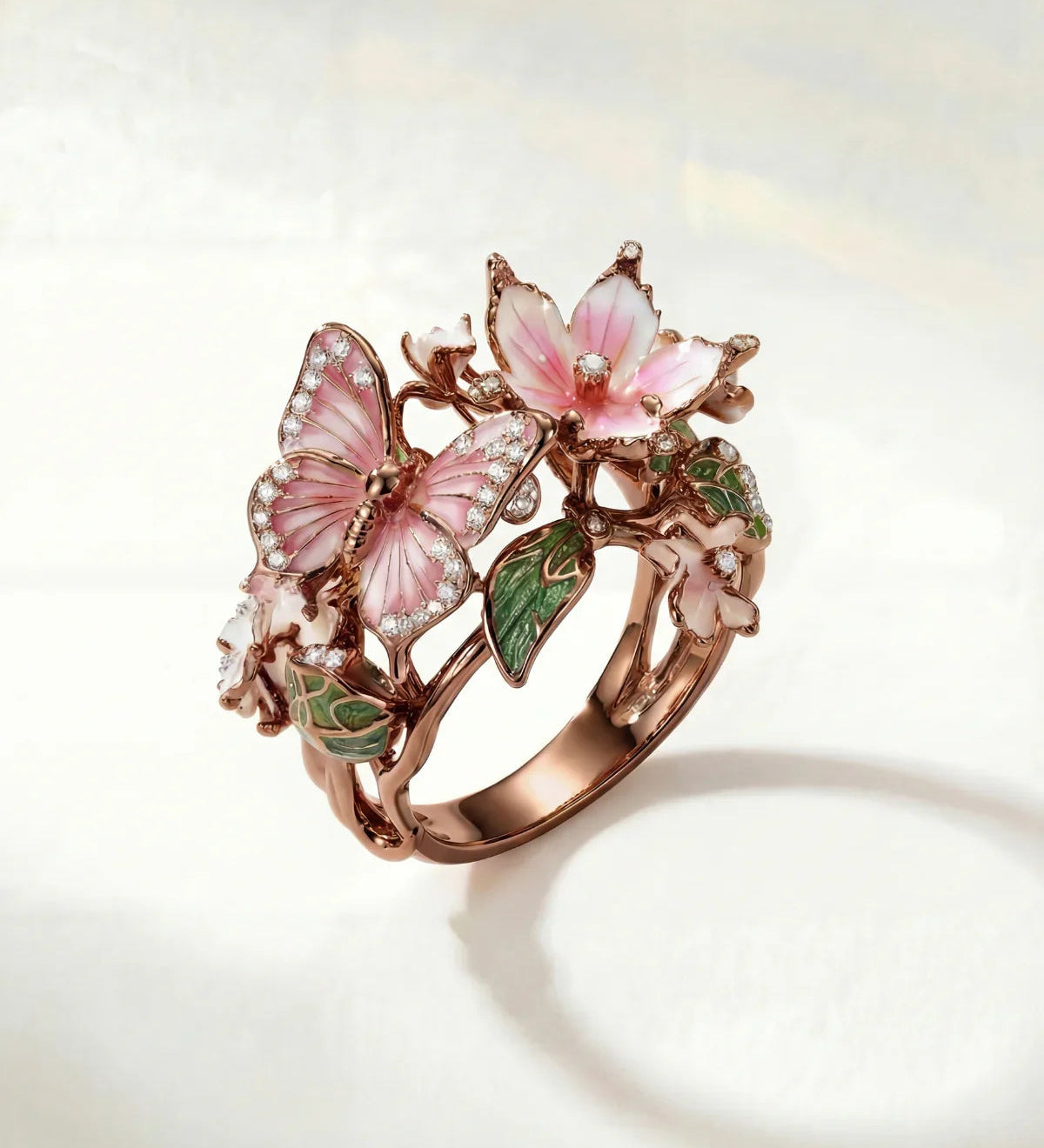 Bronze spring ring with pink flower, butterfly details and green leaf accents