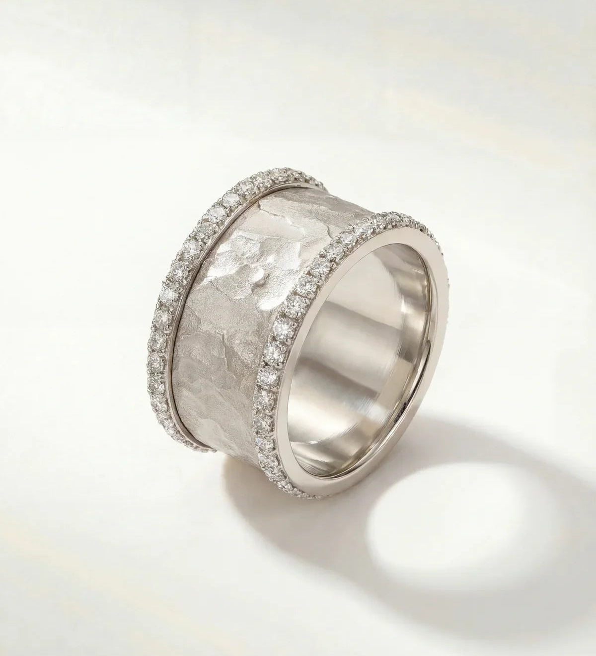 Silver textured ring with pavé edges