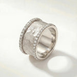 Silver textured ring with pavé edges