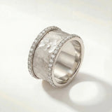 Silver textured ring with pavé edges