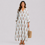 Floral summer dress in light blue with V-neck, button front, and tiered skirt