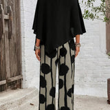 Back view: black asymmetrical top with batwing sleeves and wide-leg boho pants in dot print