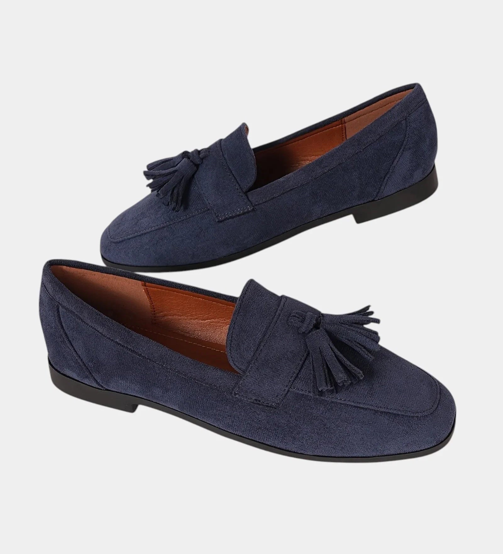 Navy blue orthopedic moccasins with tassel fringe and slip-on design, low profile sole