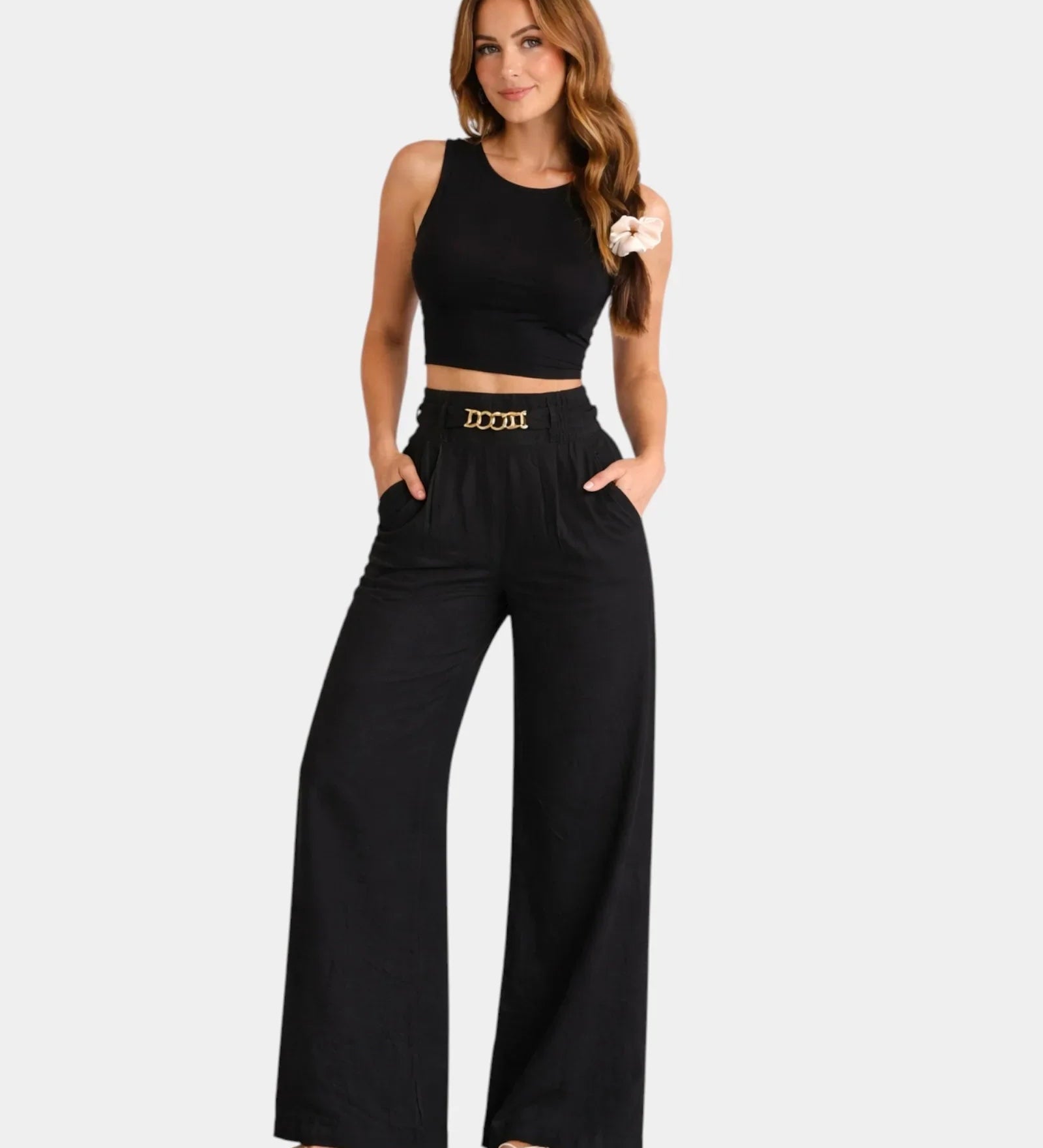 Black high-waist wide-leg pants with gold chain belt detail