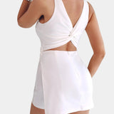 White sleeveless mini dress-effect jumpsuit, open back twist knot detail