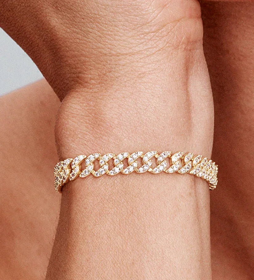 Moissanite Cuban bracelet in gold on a wrist