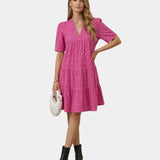 Deep pink embroidered mini dress with V-neck, short sleeves, and tiered skirt