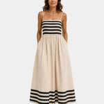 Beige long striped dress with spaghetti straps, fitted bodice and tiered skirt