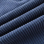 Navy corduroy pants fabric close-up with ribbed texture