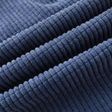 Navy corduroy pants fabric close-up with ribbed texture