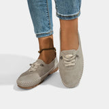 Gray suede lace-up loafers with stitch-trimmed apron toe and low profile sole.