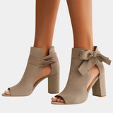 Khaki heeled sandals with peep toe, ankle bow, and block heel