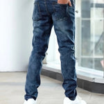 Dark blue casual stretch jeans, rear view with five-pocket construction and belt loops