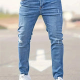 Slim-fit ripped jeans in medium blue, ripped knee rips and zip fly