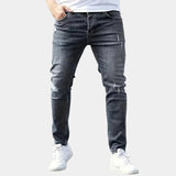 Slim-fit ripped jeans in dark wash, distressed knees and side seams