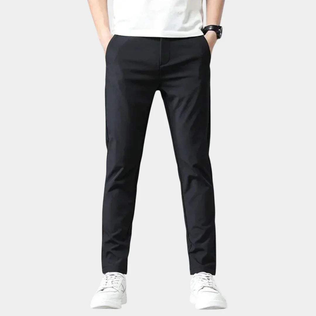 Men's black slim-fit dress pants with zip fly and tailored seams