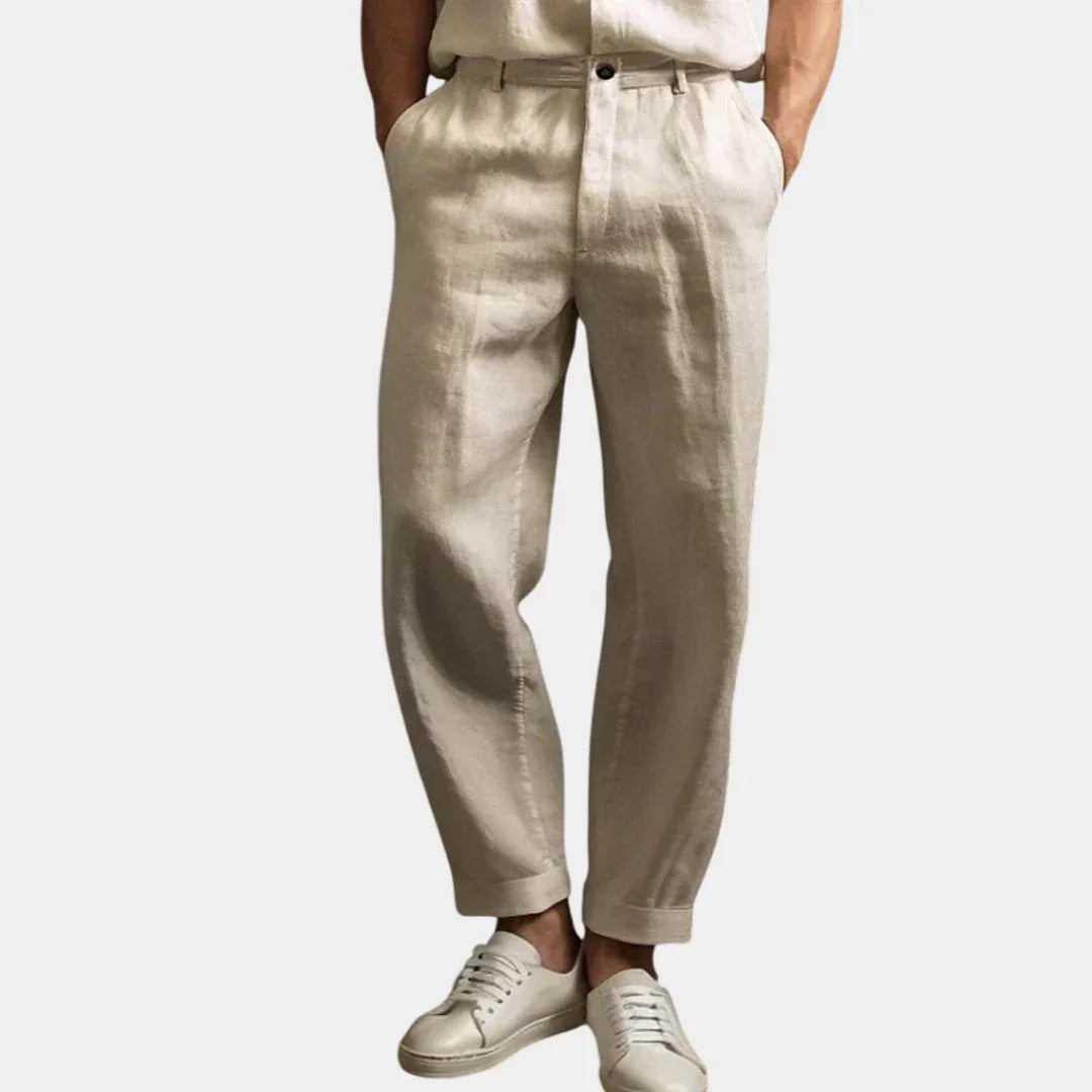 Beige summer pants with button waistband, tapered legs, ankle-length cuffs