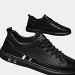 Black lace-up orthopedic shoes with padded collar and side stripe