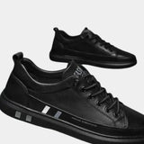 Black lace-up orthopedic shoes with padded collar and side stripe